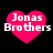 Four pink heart-shaped icons with white text "Jonas Brothers" on a black background, arranged in a