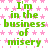 Green text reading "I'm in the business of misery" repeats across a white background with pink star patterns, no visible animation changes.