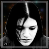 Six- of a person with long dark hair and black clothing against a dark background with scattered colored dots, each displaying different text above the head