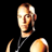 Pixelated static image of a person with light skin tone, short brown hair, and visible facial features including eyes, nose, mouth, and ear against black background.