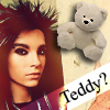 A static image shows a person with dark red hair and a gray teddy bear on a light background with text reading "Teddy?".