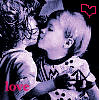 Two figures in a close embrace, one with short light hair and the other with long dark hair, against a dark background with a red heart outline and pink 'love' text.