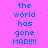 Pixelated text on pink background with blue highlight changes across frames showing 'the world has gone MAD!!!!' in different sections.