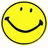 Yellow circular face with black outline, two square eyes and a curved smile on white background.
