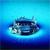 Pixelated blue-toned image of a vehicle with visible headlights and a dark body against a gradient blue background.
