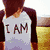 A four- shows a person in a 'I AM' shirt, an owl, 'city' text with fireworks, and a grayscale cityscape