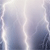 A static pixelated image with a gradient background transitioning from light gray to dark blue, featuring vertical white lines on the left and right edges.