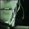 A static image of a stylized figure with flowing white lines against a green and dark background, showing partial facial features and a curved body shape.
