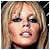 Pixelated image of a person with blonde hair and makeup, showing two distinct facial expressions