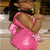 A pixelated figure in a pink dress holds a golden object, with visible differences between showing slight movement