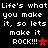 Pixelated text repeats 'Life's what you make it, so lets make it ROCK!!!' with red stars on black background.