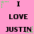 Pink background with black text repeating 'I LOVE JUSTIN' in a , surrounded by green pixelated star-like shapes