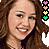 A pixelated close-up of a smiling person with long brown hair, wearing a dark top, with a vertical strip of small colored icons on the right edge.