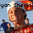A pixelated image of a person wearing a Santa hat and red-and-white checkered shirt, with a blue background and partial text above the head.