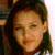 Pixelated close-up of a person's face with dark hair, closed eyes, and light skin tone against a blurred background.