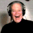 A split-frame contact sheet showing a person wearing headphones on the left and green text reading "Original Icons .com" on the right against a dark background.
