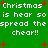 Green background with white pixelated text repeating 'Christmas is hear so is hear so spread the spread the cheer!!' and red plus signs scattered throughout.