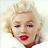 Static 48x48 pixel icon of a stylized female face with blonde hair, red lips, and visible facial features rendered in low-resolution pixels.