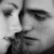 Black-and-white pixelated image of a stylized face with prominent eyes and a vertical line dividing the composition.