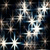 A static image of multiple white starburst shapes scattered across a dark background with blue and brown pixelated tones.