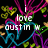 Pixelated icon with white text "love just in" over abstract colorful shapes on black background.
