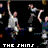 Pixelated static image of multiple figures in motion with text at bottom, likely a band logo or promotional art for The Shins.