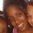 Pixelated image of two people with dark hair and light skin smiling, set against a black background with pink text elements.