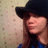 A pixelated image of a person wearing a black hat and blue top, with orange text reading 'Love me' appearing on the right side.
