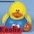 Pixelated yellow duck with orange beak and feet, wearing blue overalls with white trim and light blue cloud shapes, standing against a light blue background with red text reading "Koolie" at the bottom.