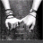 Black-and-white animation of hands clasped together with text "NEVER LET GO" progressively appearing across frames.