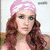 A static image of a person with long red hair in various poses including wearing a pink headband, making a peace sign, and holding a microphone.