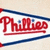 Triangular pennant-shaped icon with red 'Phillies' text, blue stripes, and white background; one version shows a grayed-out section.