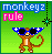 Pixel art icon of a monkey wearing sunglasses with text "monkeyz rule" on green background, featuring blue and pink pixelated lettering and a small star-like graphic.