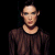 Static pixelated image of a person in dark clothing against black background with visible dithering and low-resolution rendering artifacts.
