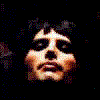 repeated human faces with varying hairstyles and expressions against a dark background, each face showing subtle differences in hair length and facial features