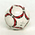 Static 50x50 pixel icon featuring a stylized ball with red and dark green curved lines on a light gray background, rendered in low-resolution pixel art style.