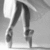 A grayscale icon shows a stylized figure with long limbs and a curved torso, standing against a light background with subtle gradient shading.
