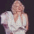 Pixelated image of a woman in white clothing with blonde hair, surrounded by repeated 'Hollywood' text and star symbols on black background.