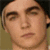 Pixelated image of a person with dark hair and neutral expression next to blue text blocks on white background.