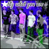 Group of six people standing in a line against purple background with white stars; text "stay what you are" at top.