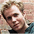 A split-frame contact sheet showing a pixelated portrait on the left and green text logo on the right against dark background.