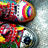 Two pixelated, colorful, rainbow-hued circular icons with abstract patterns on a light gray background, next to pink pixelated text reading "love, peace, harmony." on black.