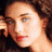 A 48x48 pixel animated contact sheet showing three sequential frames of a woman with curly brown hair in different poses and color treatments.