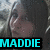 A pixelated image of a person with dark hair and light skin, overlaid with three distinct text blocks in cyan, green, and magenta.