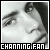 Pixelated grayscale image of a person's face with dark hair, featuring visible eyes and mouth, framed by black border with text at bottom.