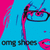 Pixelated anime-style face with blue skin, pink hair strands, black glasses, and red lips; text "omg shoes" appears below the face in four