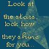 A static image with a blue background featuring a large, faded star shape and yellow text reading "Look at the stars, look how they shine for you...".