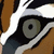 A close-up of a tiger's eye with brown, black, and white stripes, showing a greenish-gray iris and black pupil in one frame, and a closed eye in the next frame.