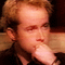 Pixelated image of a person with light brown hair resting hand on chin, next to pixelated text reading 'OH, TO BE THOSE FINGERS' in blocky font.