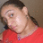A pixelated image of a person in red clothing against a brown background, with bright pink text overlays reading "Diz Dominicana," "Iz Too Crazi," and "For Yew." The style is low-resolution digital art.